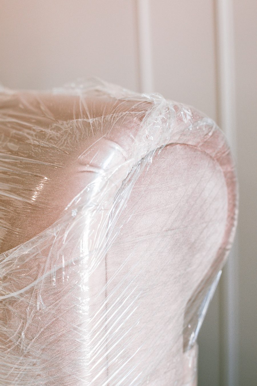 Upholstered armchair carefully wrapped for a move